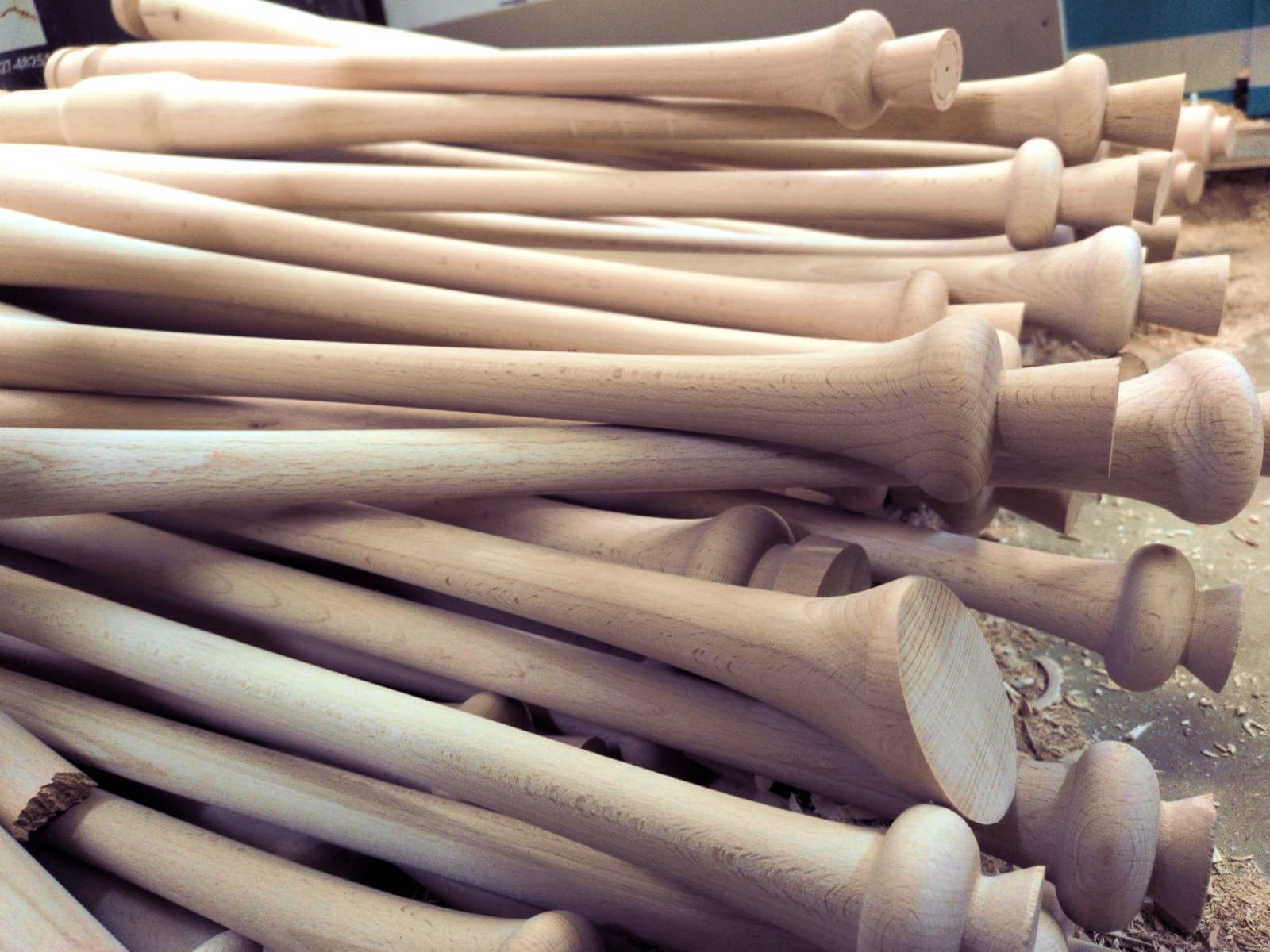 A dense stack of turned spindles, seen close, with the different profiles in a row.